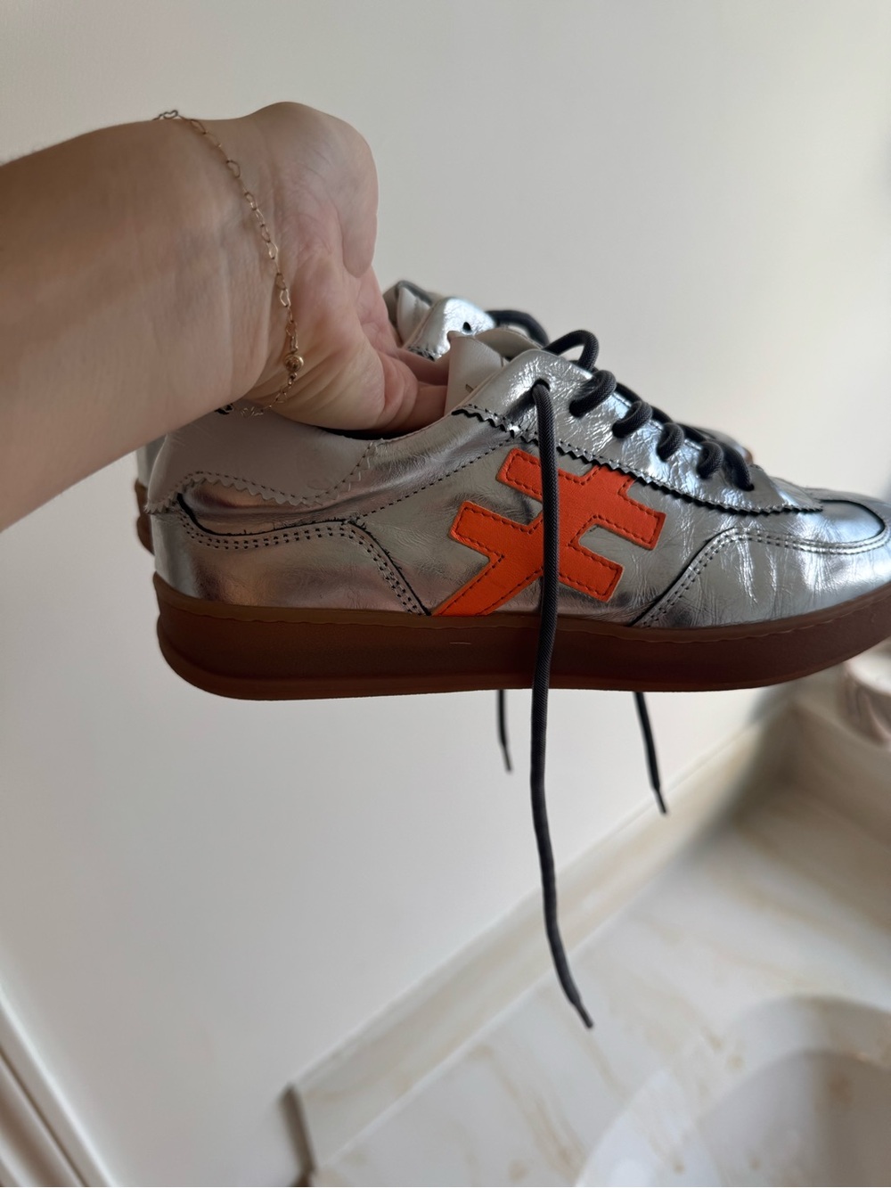 Men's Metallic Silver Sneaker with Orange Logo Accent